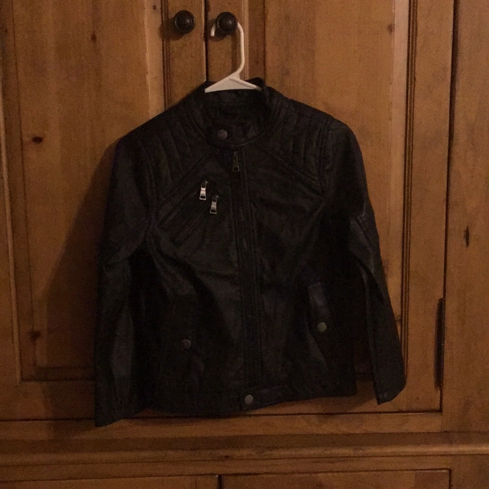 Black Leather jacket with five different types of pockets.